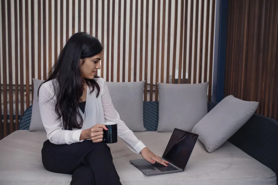 Person reading a welcome email on a laptop at a desk